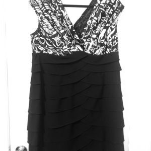 Deep V neck black and white semi formal dress.